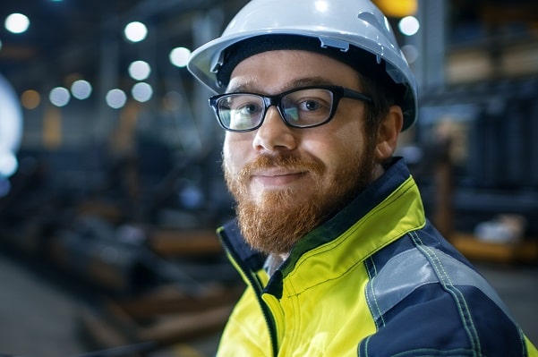 industrial worker wearing safety glasses and hard hat